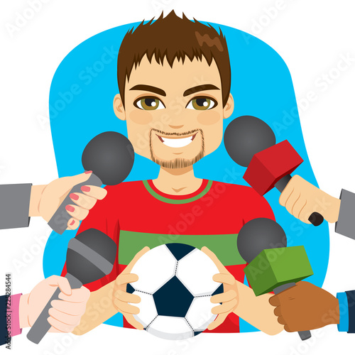 Young male soccer football player holding ball and hands holding microphones on interview
