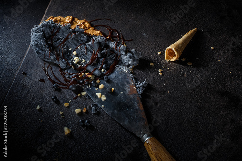 Smashed black ice cream sundae on a spreader tool