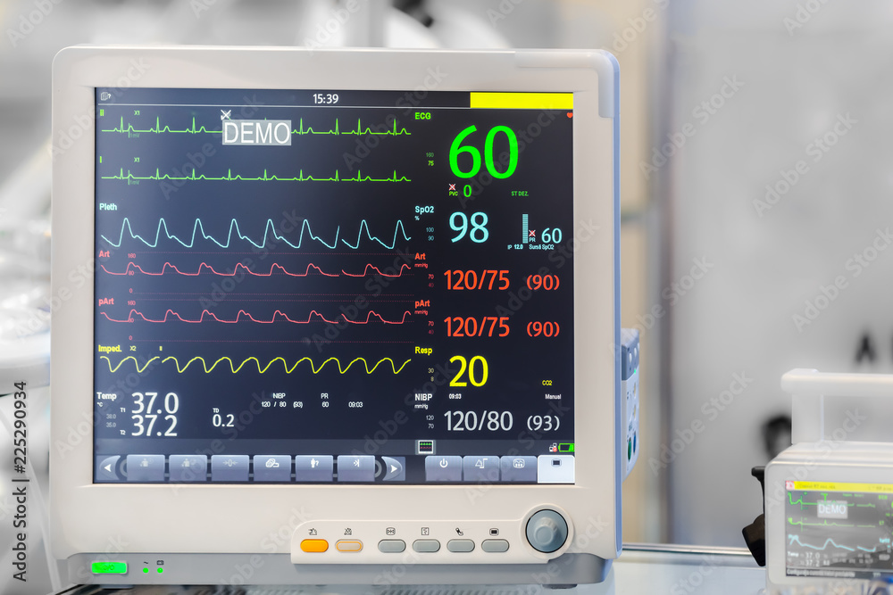 diagnostic medical equipment with cardiogram on the screen, background image with space for text