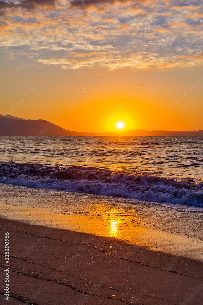 Fototapeta premium Early morning , dramatic sunrise over sea and mountain. Photographed in Asprovalta, Greece.