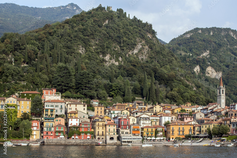 Look at the village at the foot of the magnificent Alpine hills, northern Italy. Lago di Como.