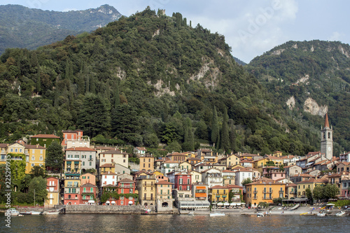 Look at the village at the foot of the magnificent Alpine hills, northern Italy. Lago di Como. © Petia