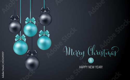 Christmas background with blue and black evening baubles