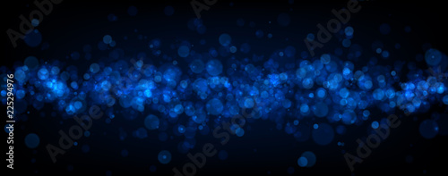 Blue abstract blurred banner with bokeh effect.