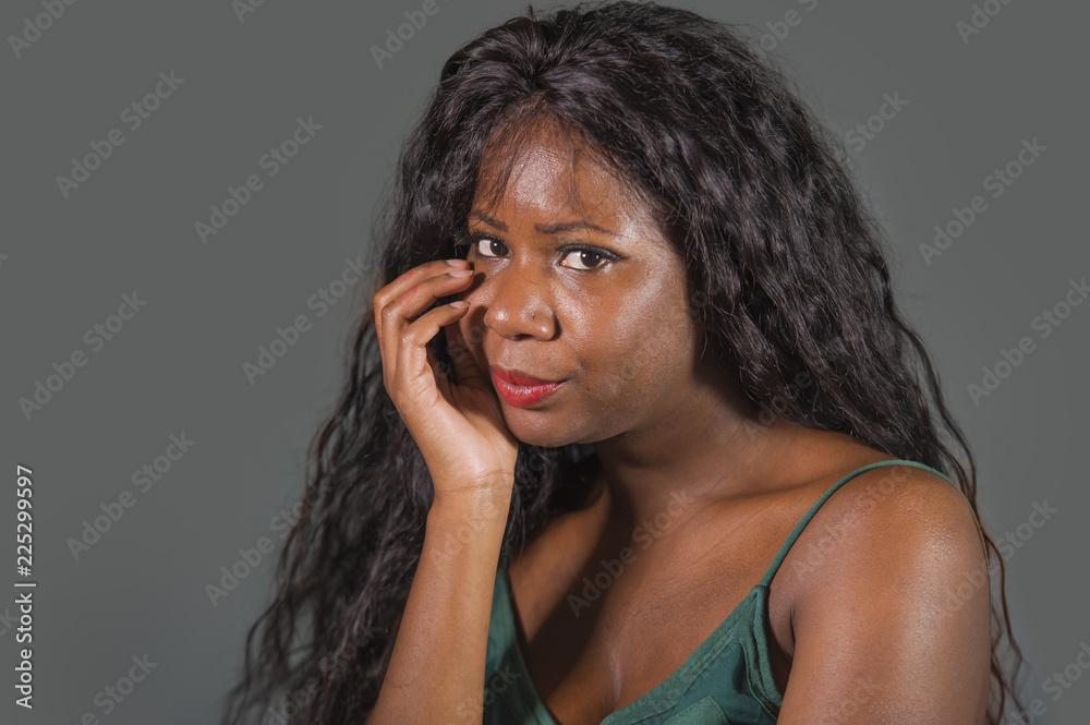 Fototapeta premium young attractive sad depressed black African American woman feeling bad and desperate suffering anxiety crisis and depression problem in intense face expression