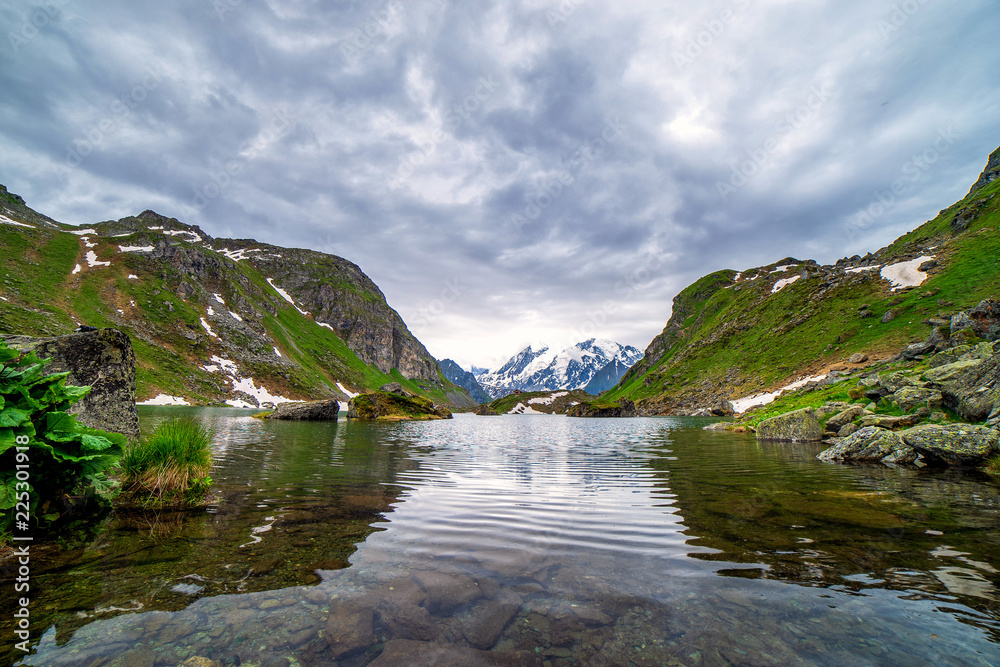 Obraz premium Swiss alps water reflection in Lac de Louvie - mountain lake above Val de Bagnes valley, Switzerland.