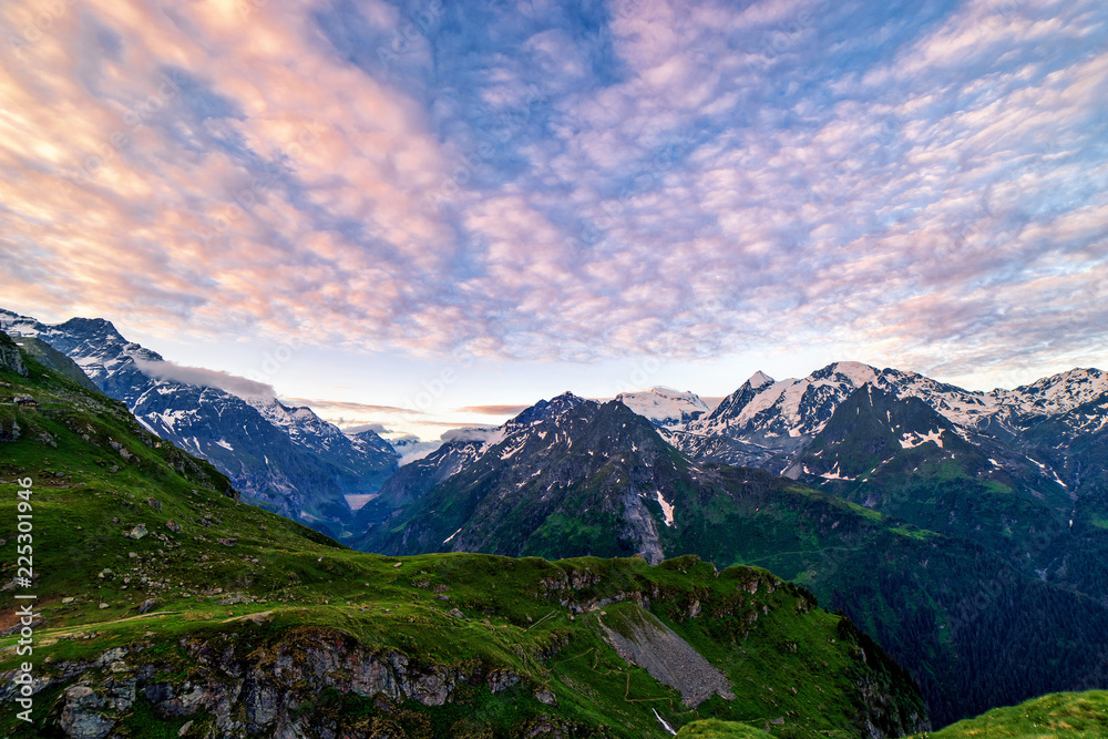 Obraz premium Scenic view of beautiful Swiss Alps mountains. Blue hour sunset with pink and blue tones, Verbier, Canton du Valais, Wallis, Switzerland.