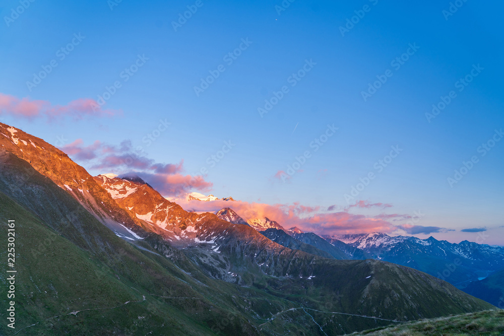Obraz premium Scenic view of beautiful landscape of Swiss Alps in a Val De Bagnes area. Dramatic sunset scene in high mountains.