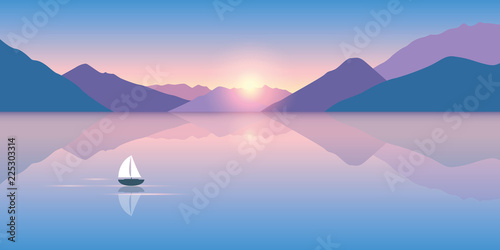 lonely sailboat on a calm sea with a beautiful mountain view at