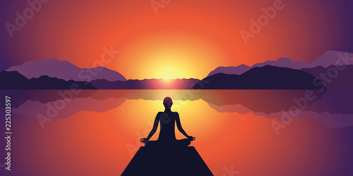 meditation silhouette beautiful sunset at lake and mountain landscape background