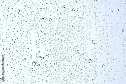 gray wet background / raindrops to overlay on the window, weather, background drops of water rain on the glass transparent