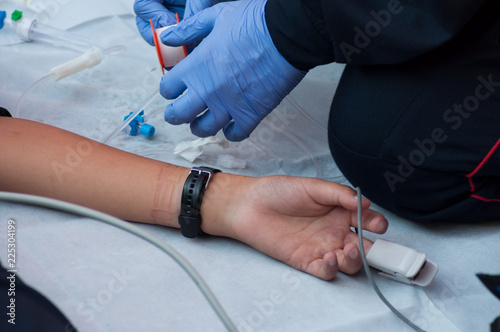 closeup of first aid on a road accident by fire men