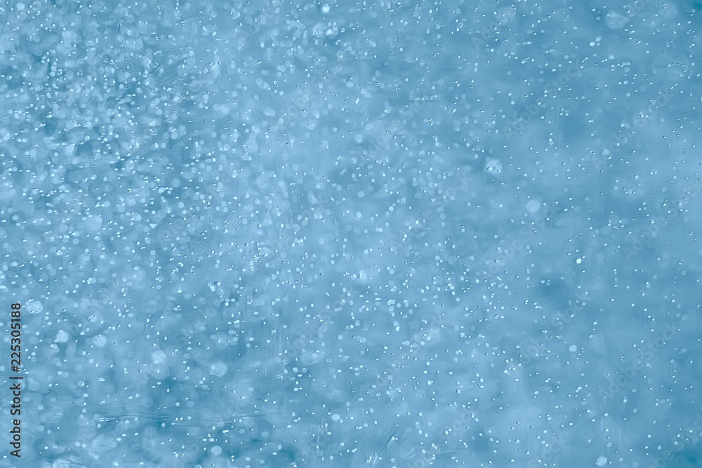 Obraz premium air bubbles in water macro background / blue background abstract bubbles in water