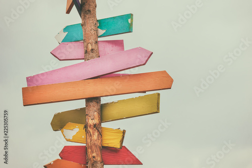 Colorful wooden direction arrow signs