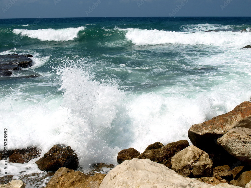 Wave splashing against stones