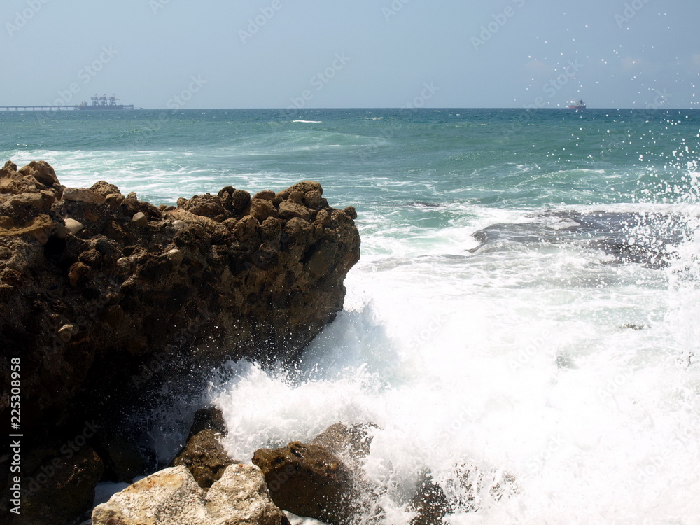 Wave with gnaws breaks about stones Wave with gnaws breaks about stones