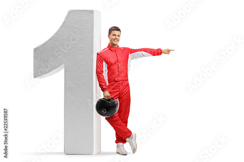 Racer leaning against a number one figure and pointing
