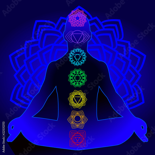 Silhouette of man with symbols of chakra
