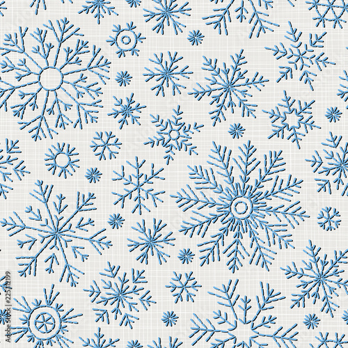 Seamless embroidery snowflakes background.