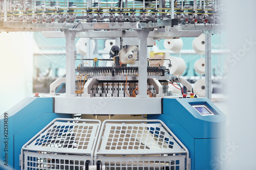 Knitted fabric. Textile factory in spinning production line and a rotating machinery and equipment production company.