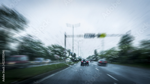 fast-moving cars on the highway and blurry effect. blurry effect of high speed car. driving at an unlicensed speed.Drunk driving a car in rainy weather.