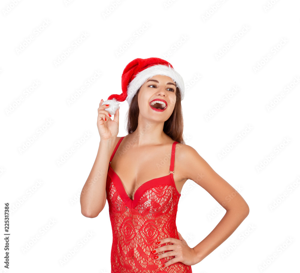 Beautiful, smiling and emotional girl in Christmas swimsuit. emotional woman in red santa claus hat isolated on white background. Happy Christmas and New Year holidays concept Beautiful, smiling and emotional girl in Christmas swimsuit. emotional woman in red santa claus hat isolated on white background. Happy Christmas and New Year holidays concept