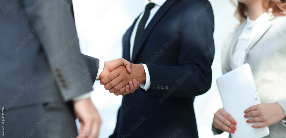 Business handshake and business people.