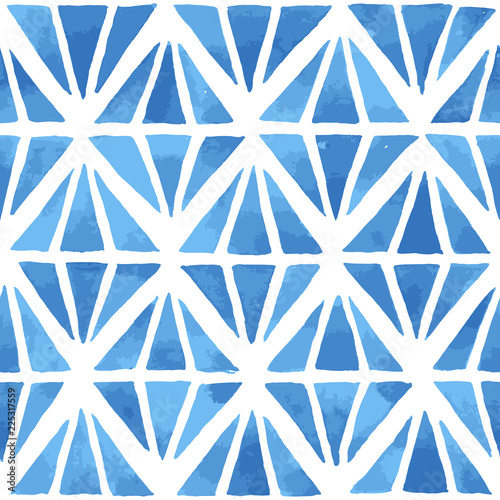 Hand painted geometric mosaic background with diamond shaped elements in blue. Seamless vector pattern