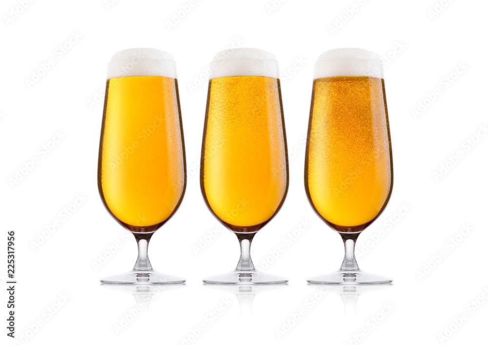 Cold glasses of lager beer with foam and dew Cold glasses of lager beer with foam and dew