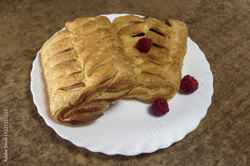 Fresh sweet pastries with raspberry jam. Sweet desert closeup. photo