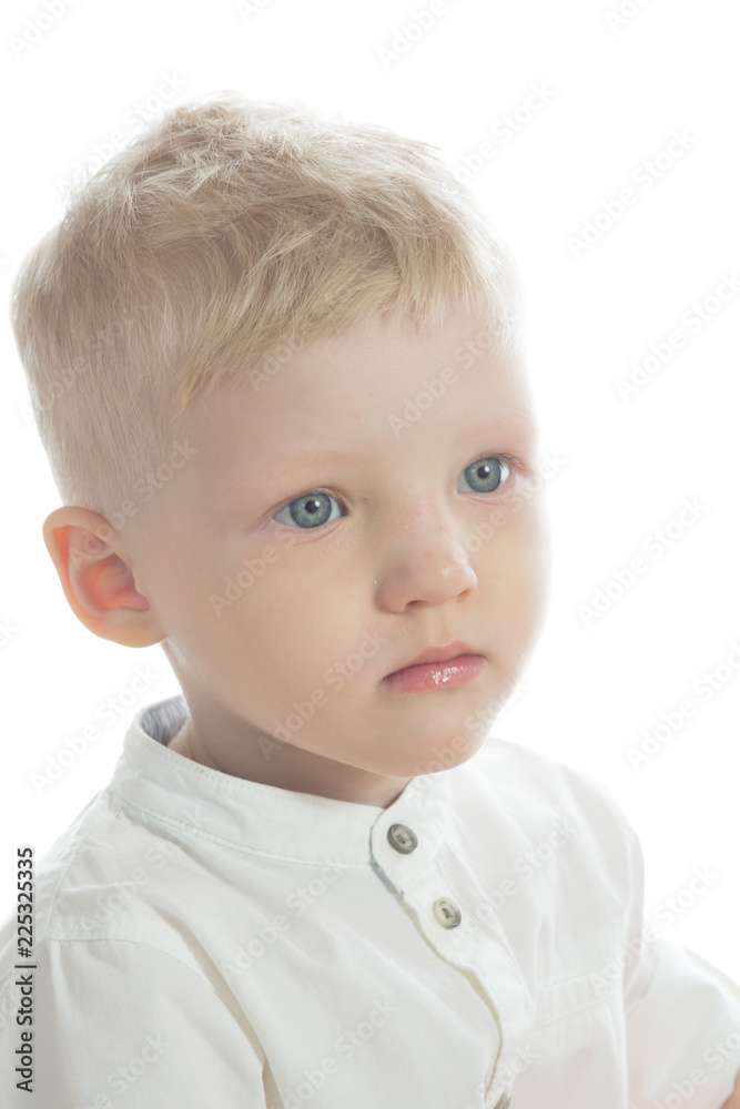 portrait of a little serious cute boy with blue eyes and blonde hair on  white background Stock Photo | Adobe Stock