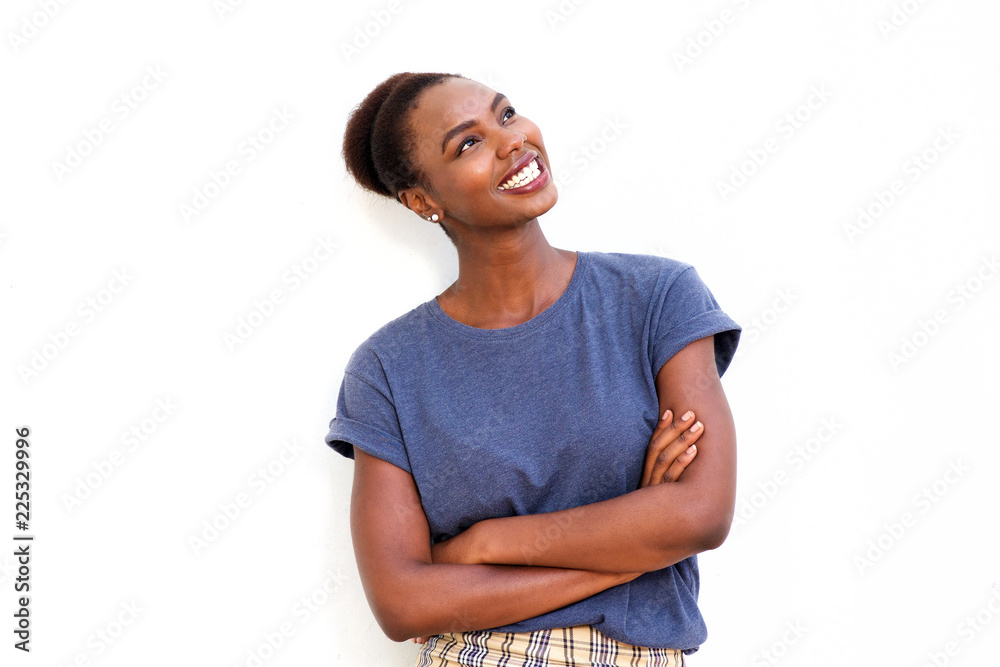 beautiful young african american woman smiling against isolated white background and looking up beautiful young african american woman smiling against isolated white background and looking up