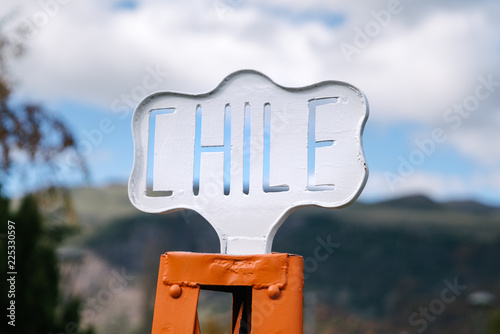 An old Chile street sign in a town square in Lonquimay, Chile. photo