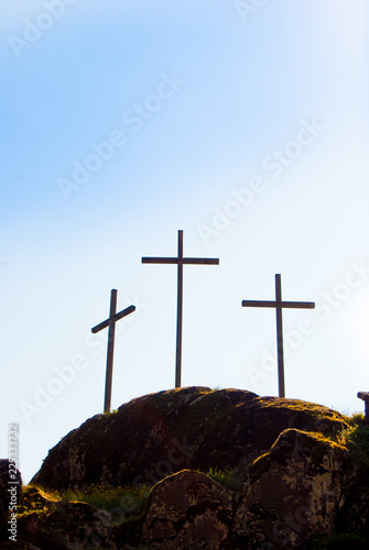 Three big Christian crosses outside in blue sky