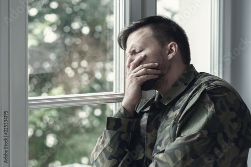 Depressed lonely soldier with emotional problem and war syndrome