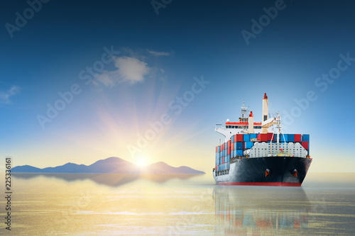 Cargo ship carrying container and running for export goods from cargo yard port to other ocean concept freight shipping ship.