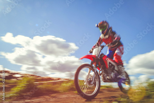 woman on enduro motocross in motion  desire for victory  dynamics of speed