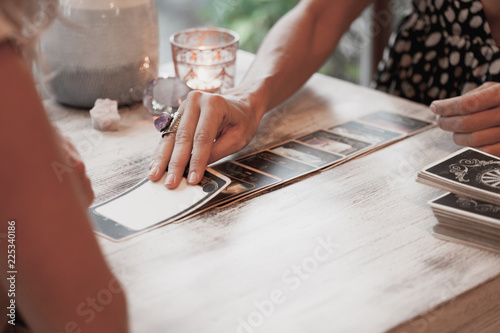 Woman is reading Tarot cards