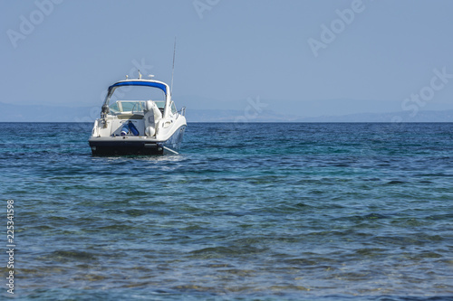 Hanioti, Greece - 09/01/2018 - Motor boat and blue water Mediterranean sea. Fun, sport,  lifestile concept. © RaDa