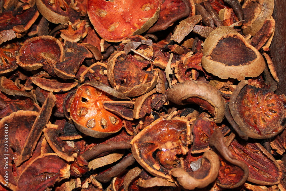 Dried bael fruit background. Close up dried herb. Many of slices of bael fruit .