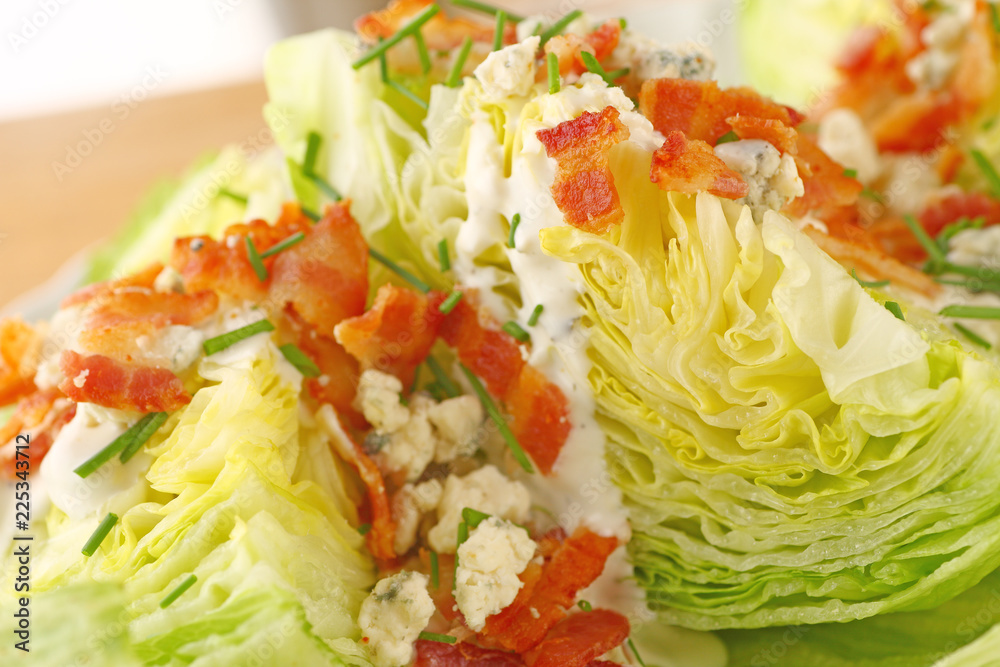 Bacon and blue cheese on fresh lettuce wedges with chives Bacon and blue cheese on fresh lettuce wedges with chives