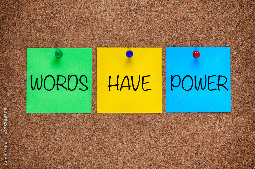 Phrase Words Have Power on corkboard.