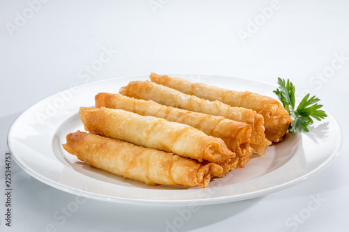Cigar Pastries on a white plate.