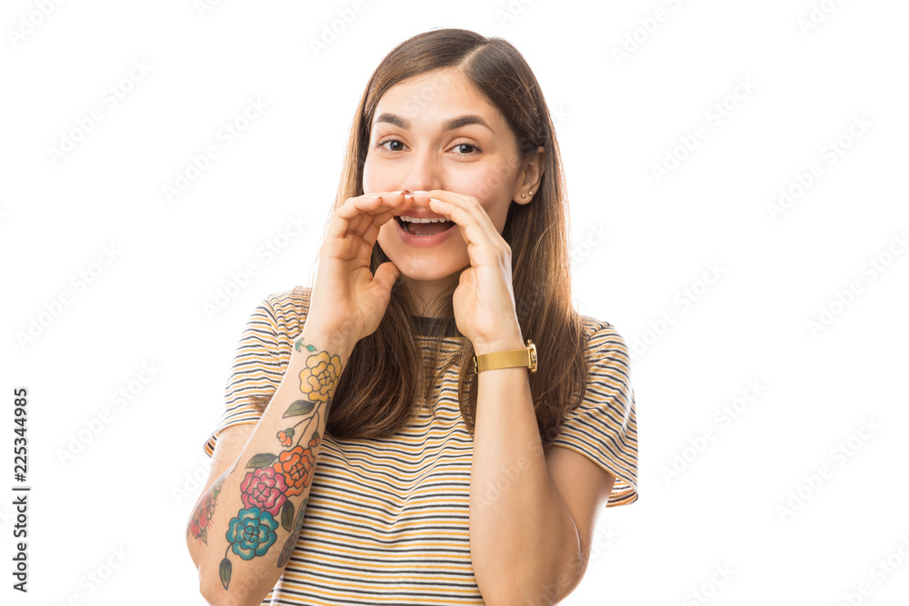 Woman Sharing Secrets While Covering Mouth With Both Hands Woman Sharing Secrets While Covering Mouth With Both Hands