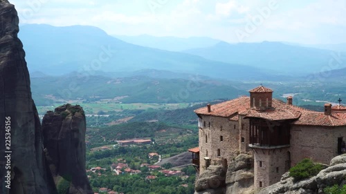 Stunning big stone rock formation on top of Pindus mountain range in aerial panoramic view on Meteora valley in Thessaly