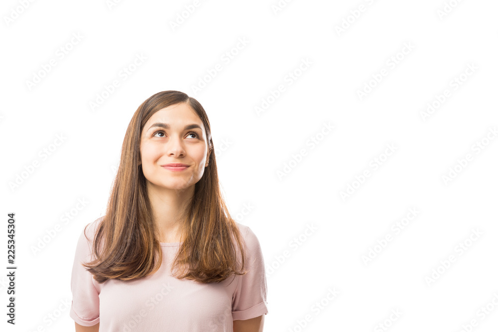 Female Smiling While Looking Up At Blank Space Female Smiling While Looking Up At Blank Space