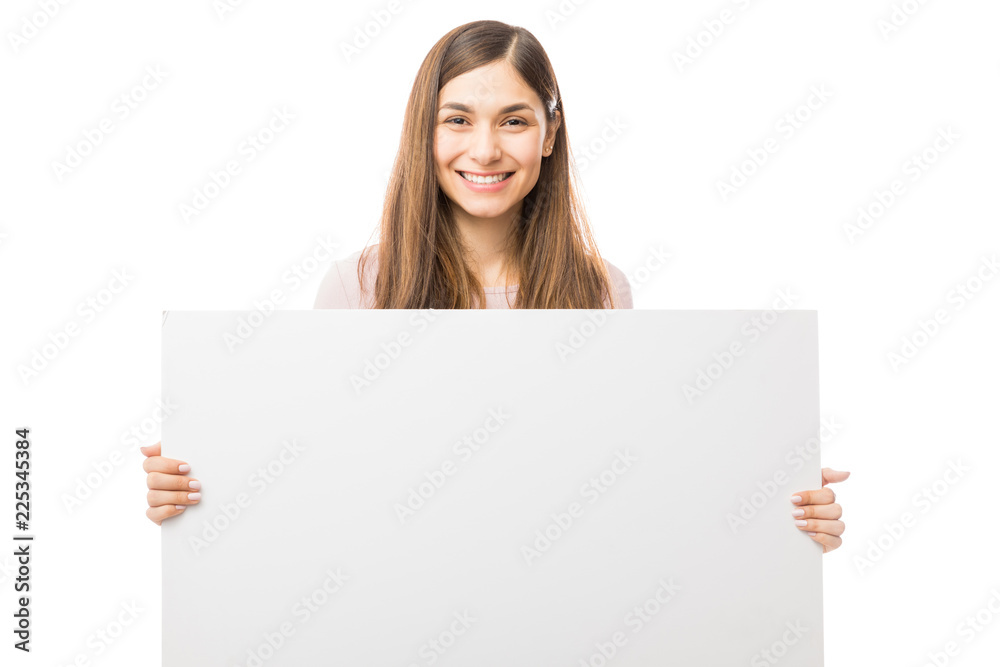 Happy Woman Holding Blank Billboard Over White Background Happy Woman Holding Blank Billboard Over White Background