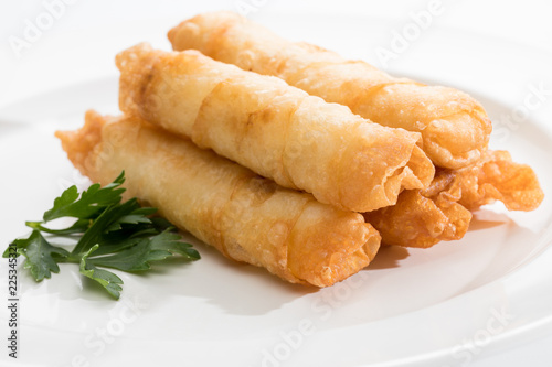 Cigar Pastries on a white plate.