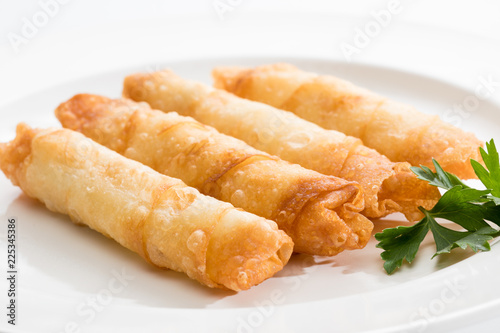 Cigar Pastries on a white plate.