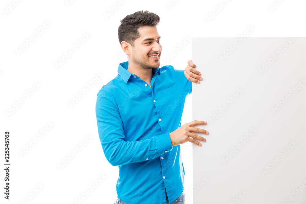 Man Looking At Billboard Over White Background Man Looking At Billboard Over White Background